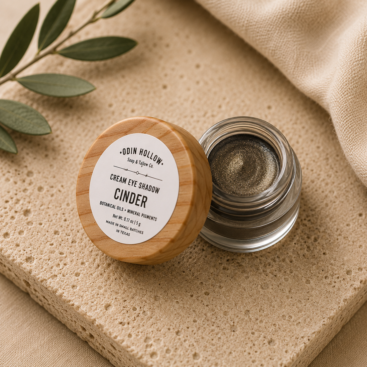 Cinder Cream Eye Shadow  Smoky charcoal with luminous bronze shimmer